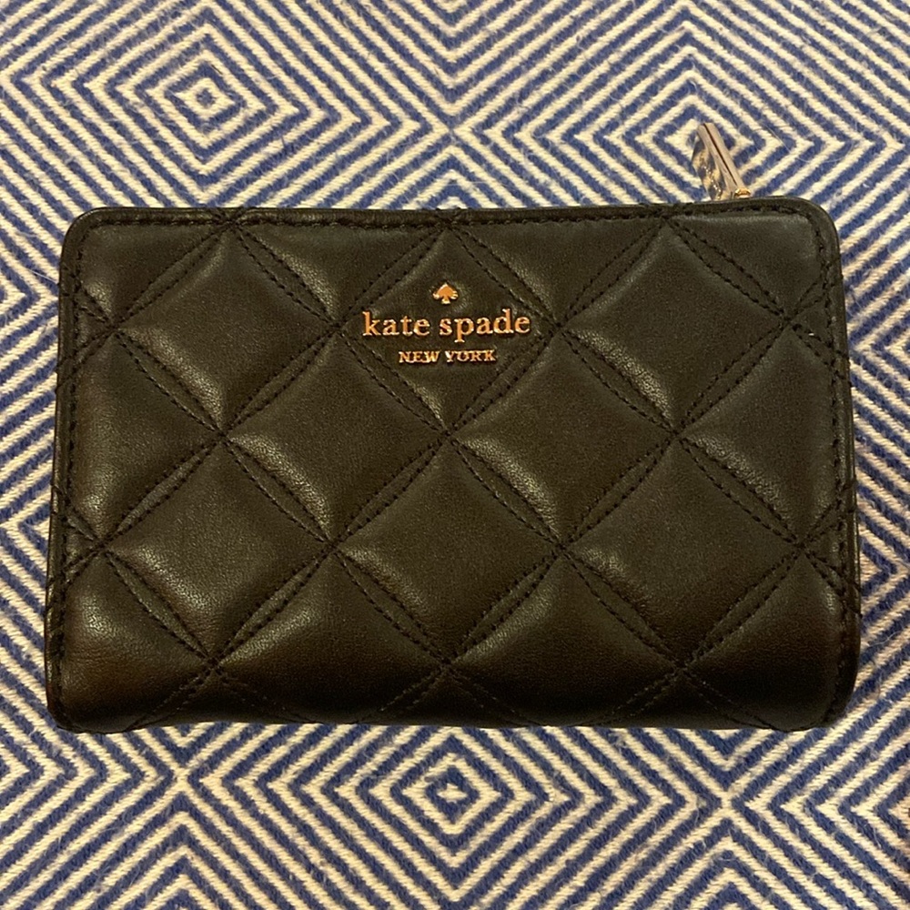 Kate spade black quilted bifold wallet with snap closure. Zipper coin pouch